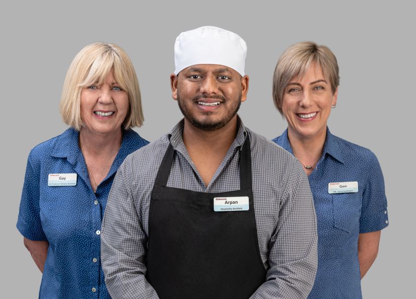 Eldercare staff members smiling to the camera.