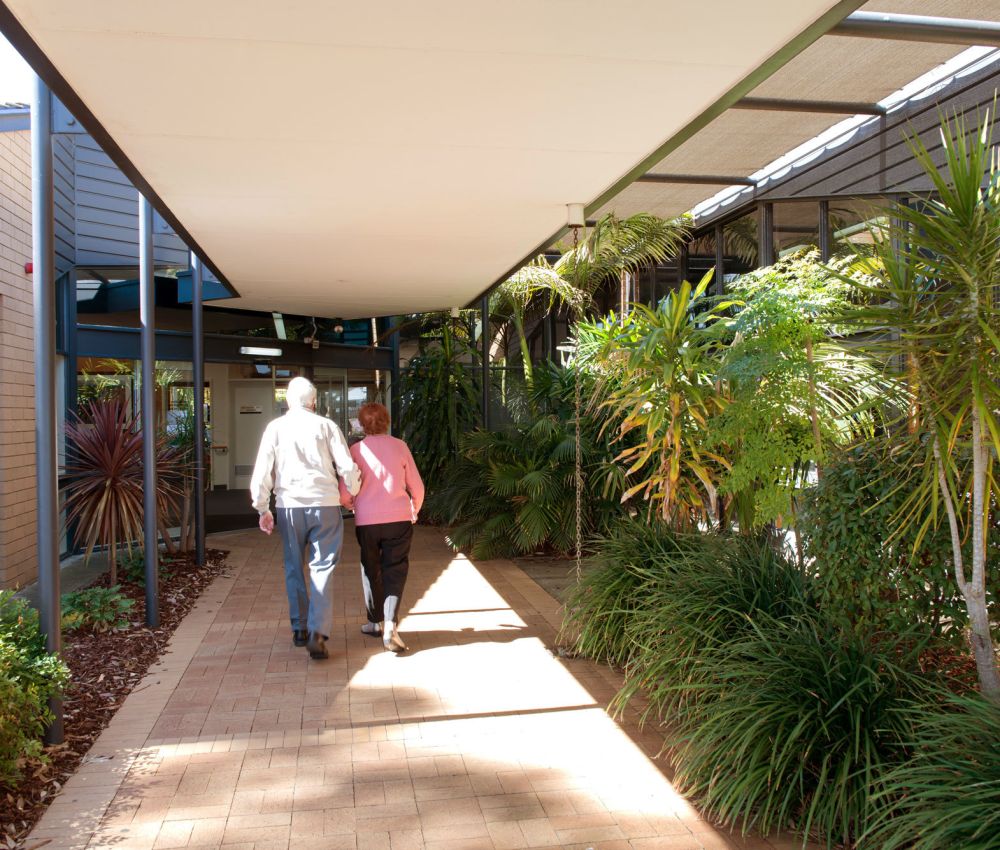 Eldercare Acacia Court's front entrance and green gardens.