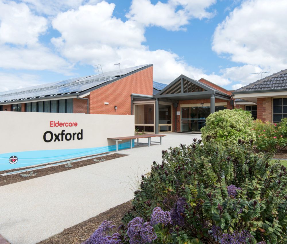 Front garden area at Eldercare Oxford complete with garden path and undercover area.