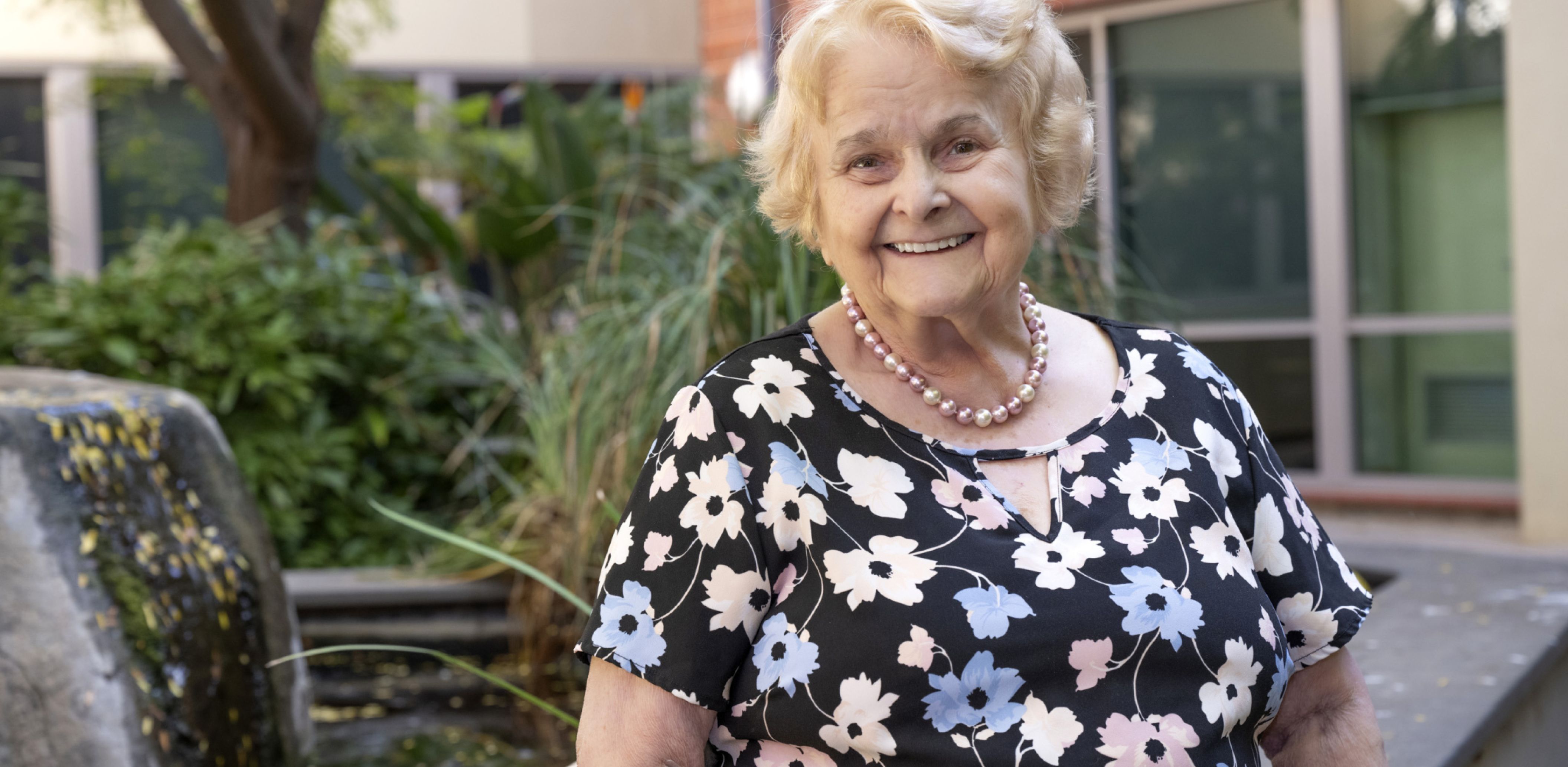 Eldercare Evanston Park resident smiling at the camera.