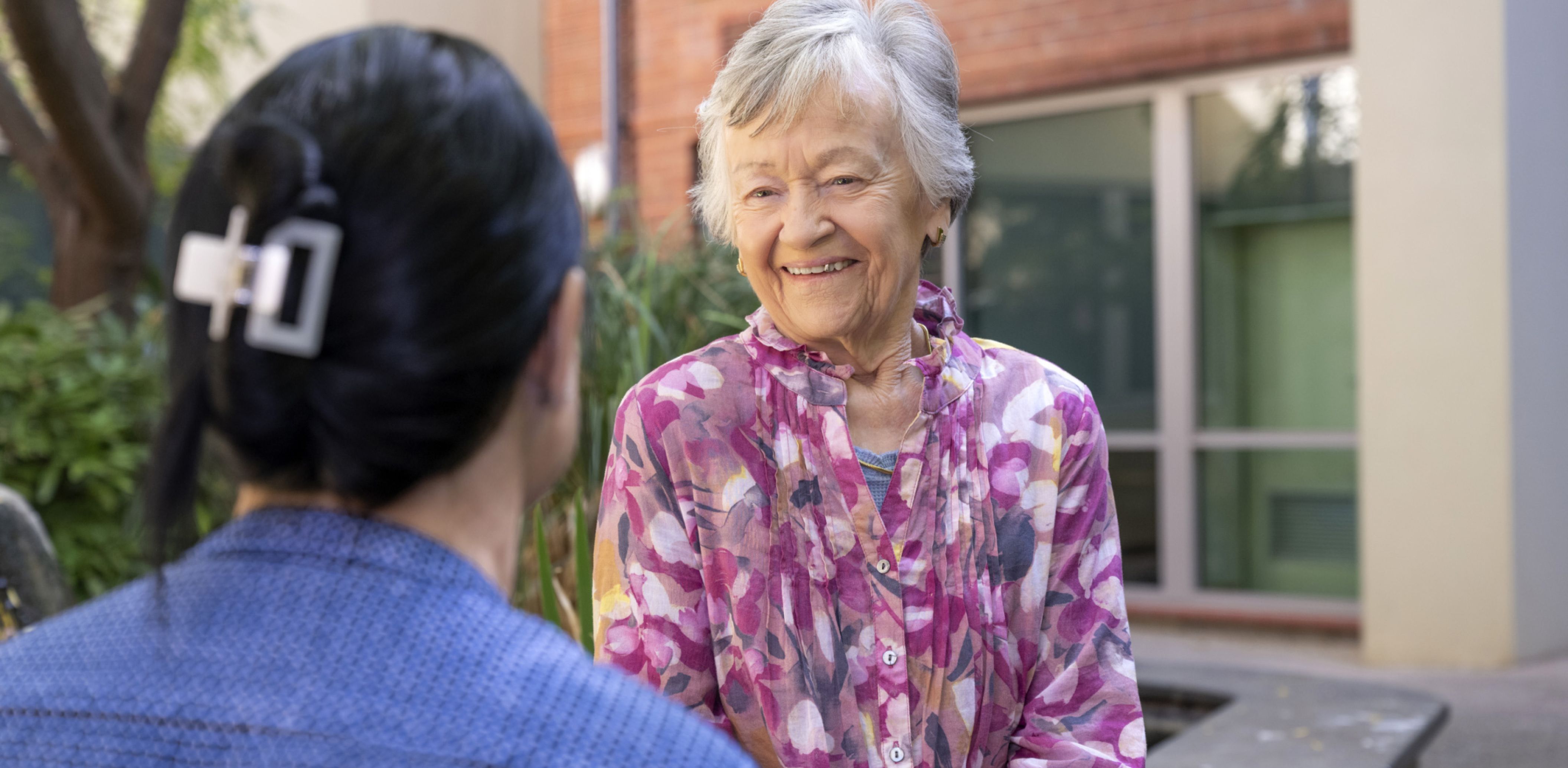 Eldercare Evanston Park resident talking to a staff member