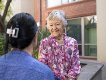 Eldercare Evanston Park resident talking to a staff member