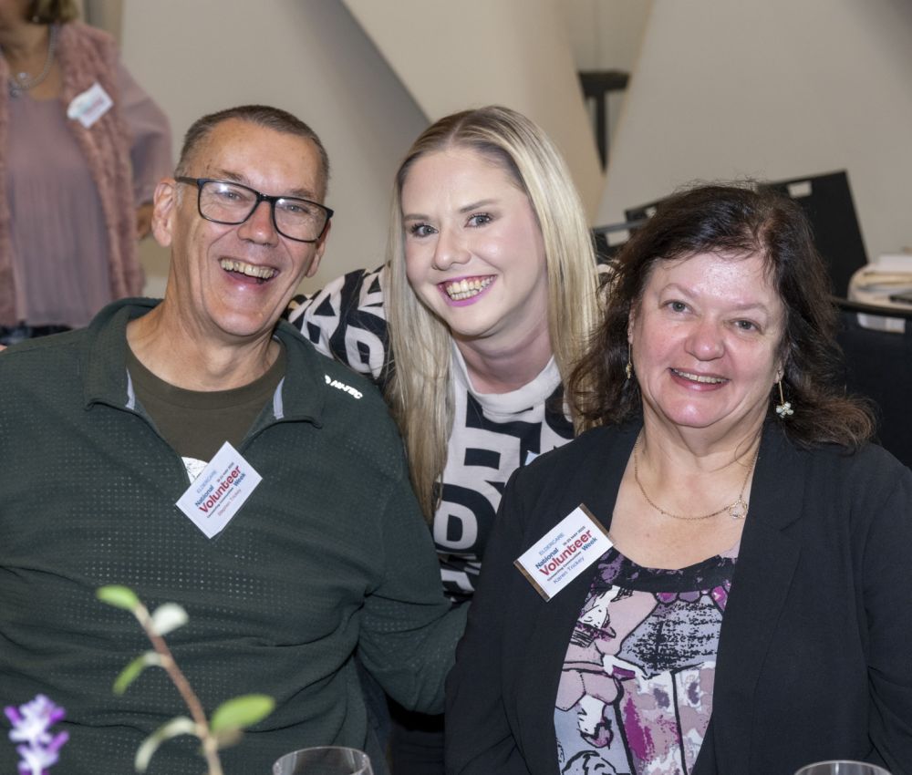 A group of people smiling at the camera.