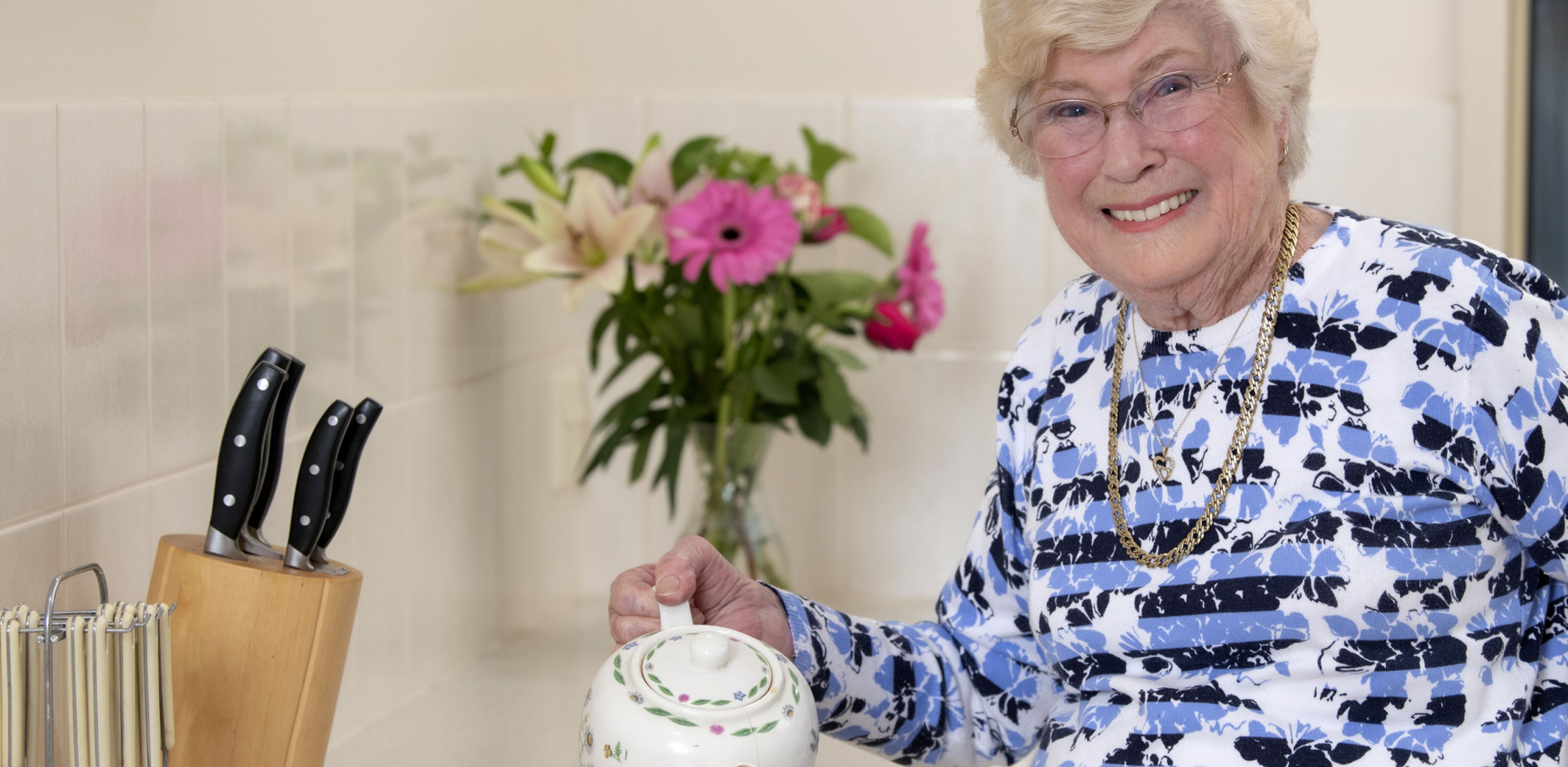 Eldercare retirement living resident making a cup of tea
