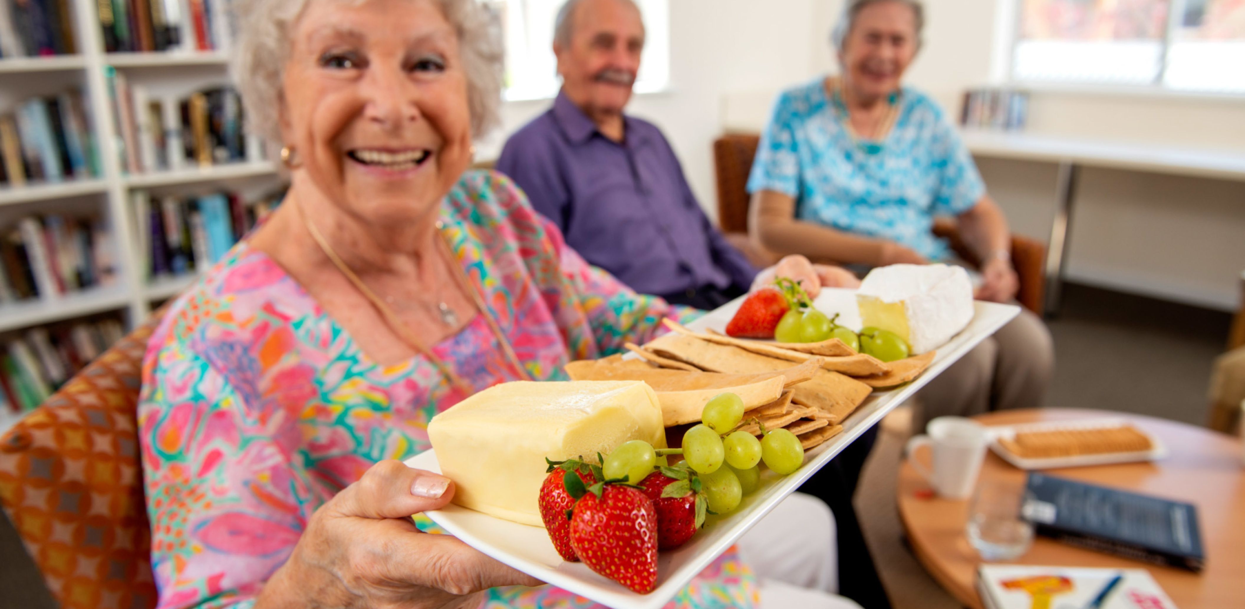 Eldercare College Green Retirement Living residents smiling at the camera.