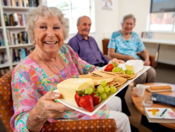 Eldercare College Green Retirement Living residents smiling at the camera.