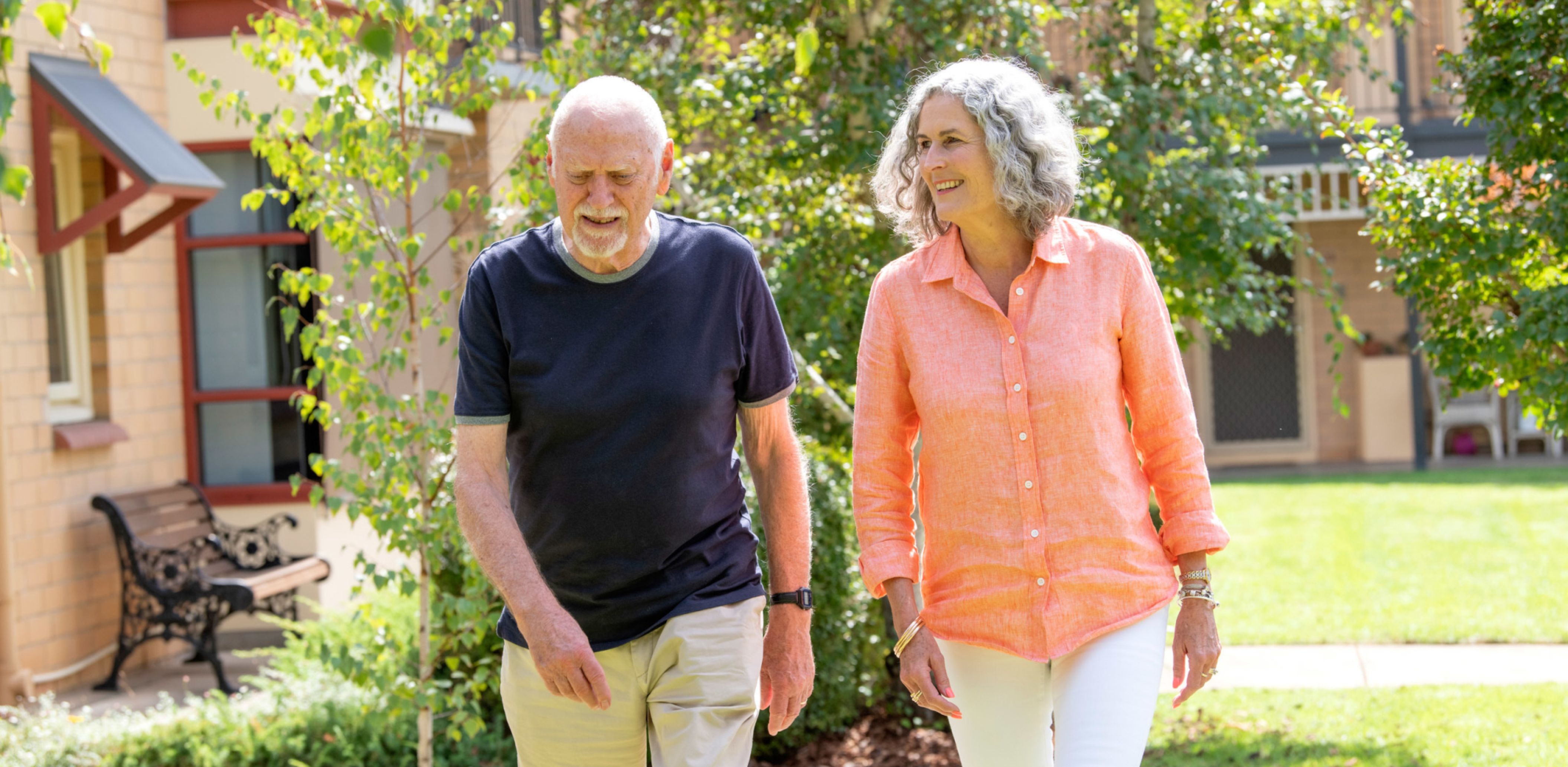 Eldercare Sash Ferguson Retirement Living residents walking and smiling.
