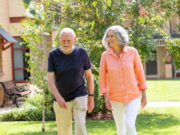Eldercare Sash Ferguson Retirement Living residents walking and smiling.