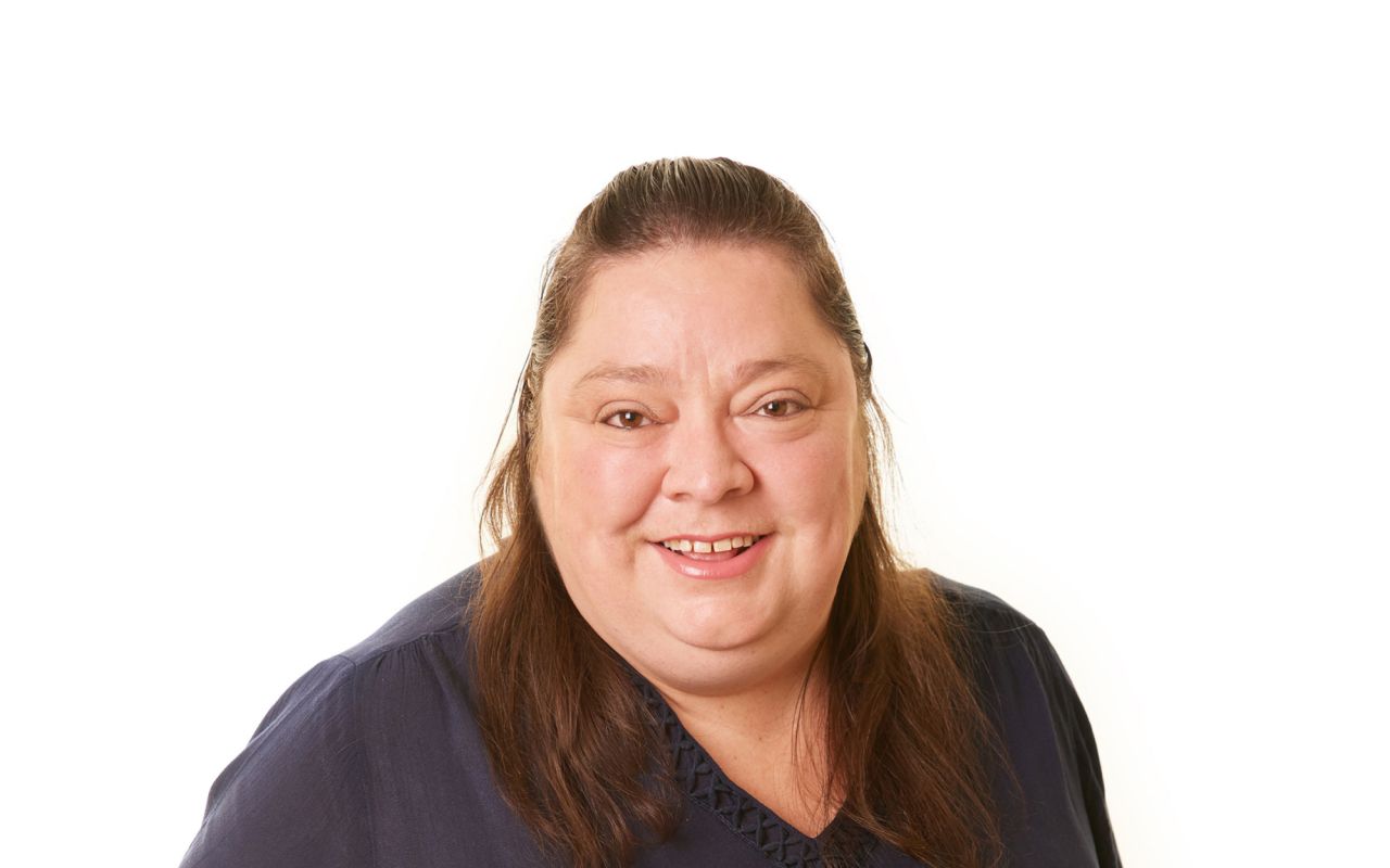 Eldercare Evanston Park Site Operations Manager Anita Elworthy smiling at the camera.